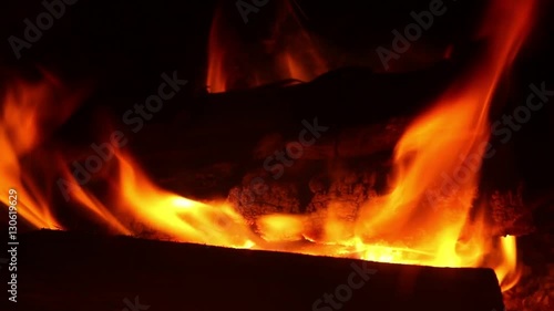 Burning wood logs in fireplace. Burning Fire background 