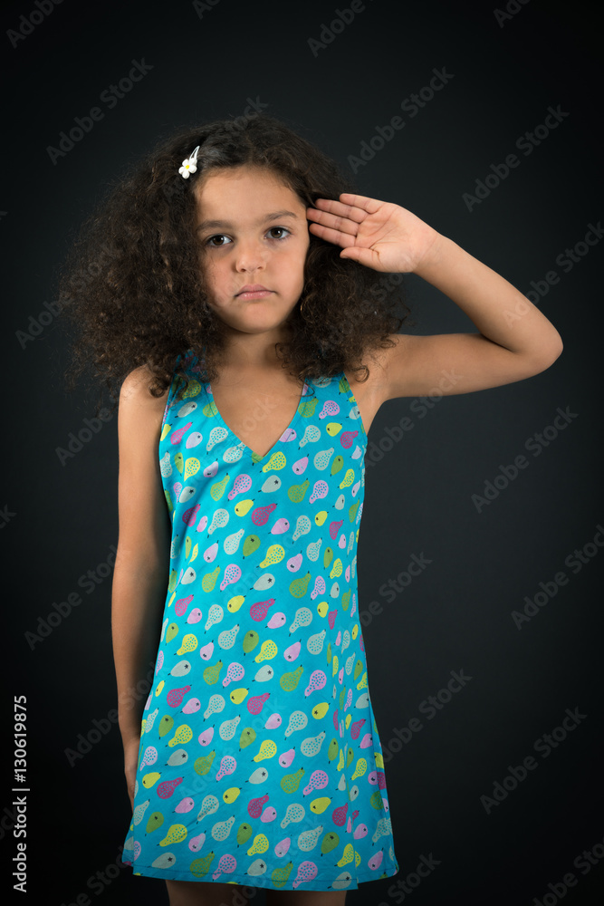 Beautiful girl doing different expressions in different sets of clothes: at attention Beautiful girl doing different expressions in different sets of clothes: at attention