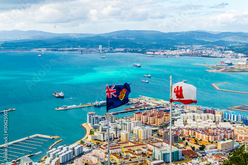 Flags of gibraltar with landscape on background.