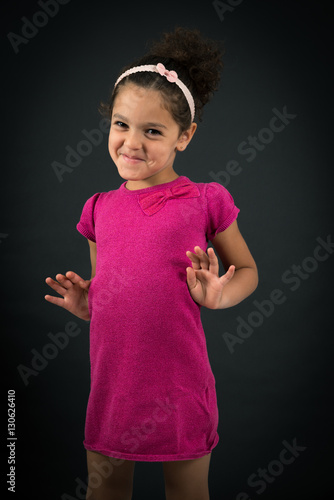 Beautiful girl doing different expressions in different sets of clothes: innocent