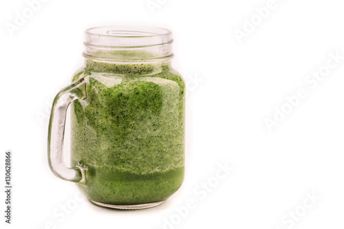 Fresh green smoothie isolated on white background. Superfood, detox and healthy food.