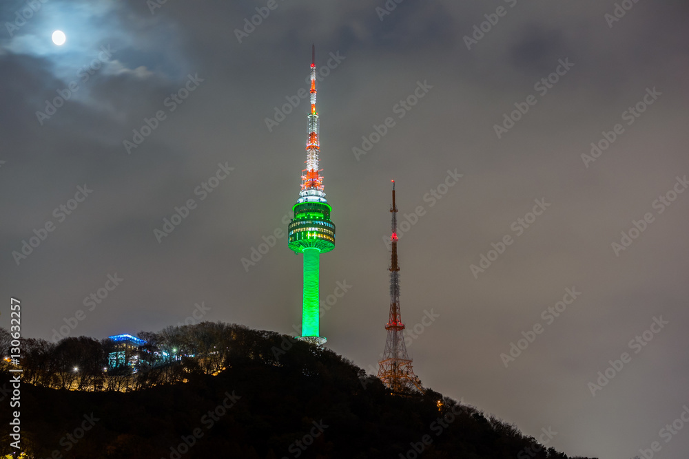 Seoul Tower with full moon on Namsan Mountain in Seoul,South Korea.