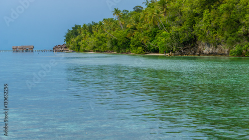 Bay with Underwater Corals in Front of Diving Station and Guesthouses on Kri Island  Raja Ampat  Indonesia  West Papua