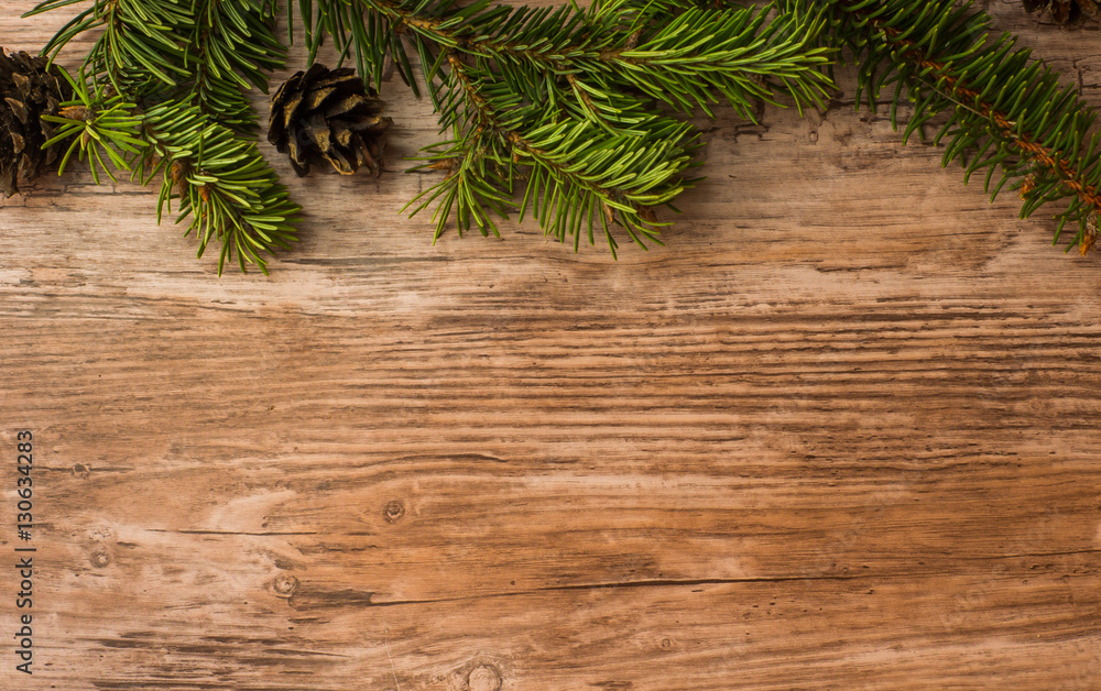 rustic christmas wooden background with pine (christmas tree) branches and cones rustic christmas wooden background with pine (christmas tree) branches and cones