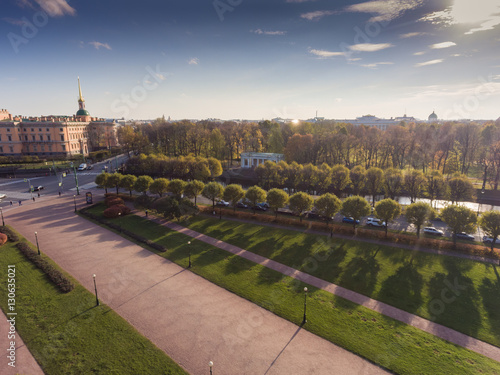 Russia, Saint-Petersburg, 24 October 2016: Aerial view of the Mikhaylovskiy Engineers' Castle, river Moyka, roofs of St. Petersburg, autumn panorama field of Mars, shadows of trees photo
