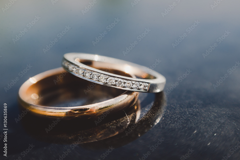 Beautiful wedding golden rings on dark background Beautiful wedding golden rings on dark background