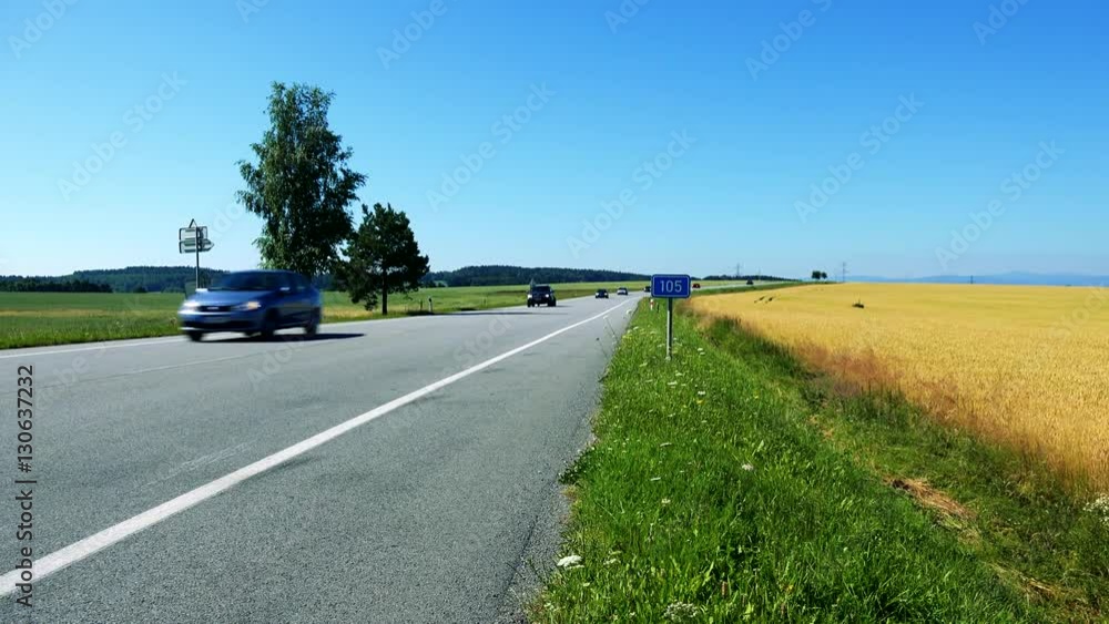 road in the countryside between fields - traffic sign with the number of road - road in the countryside between fields - traffic sign with the number of road -