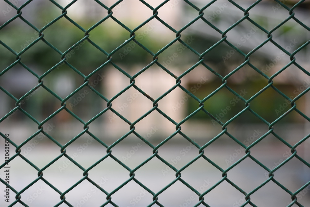 Mesh fence panel on blurred Background Mesh fence panel on blurred Background