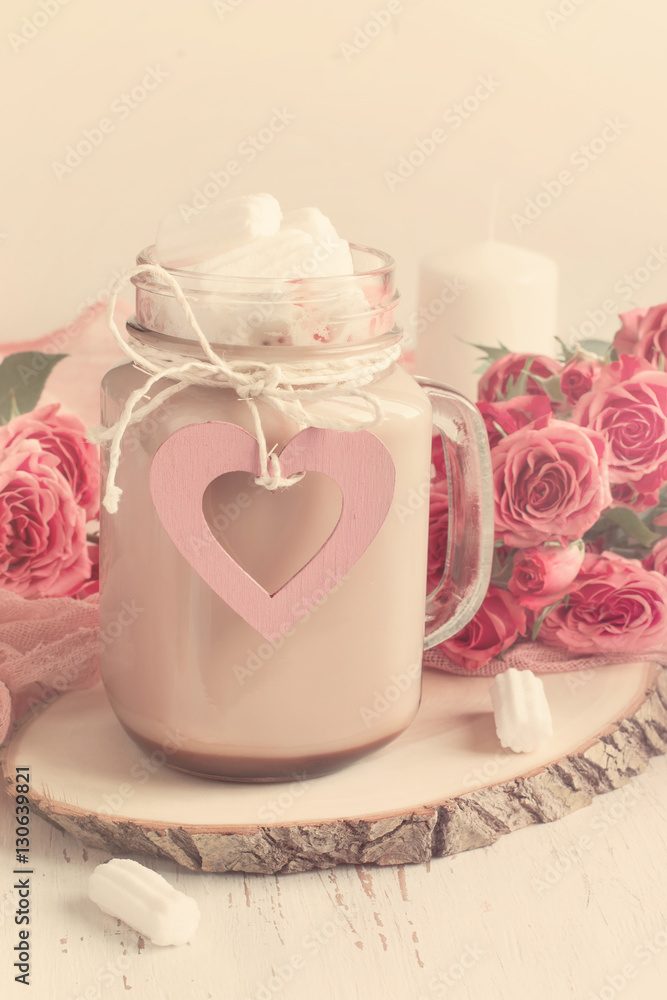 Cocoa with marshmallows and a bouquet of roses. Cocoa with marshmallows and a bouquet of roses.
