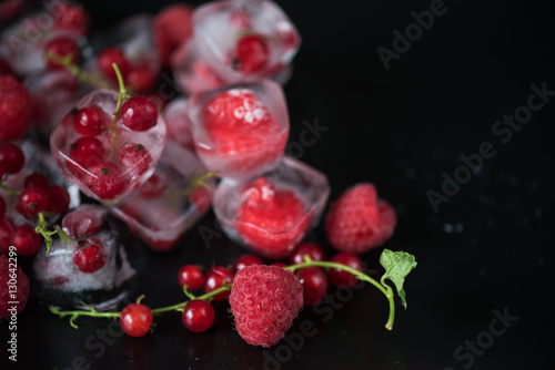 Frozen berries on wooden table