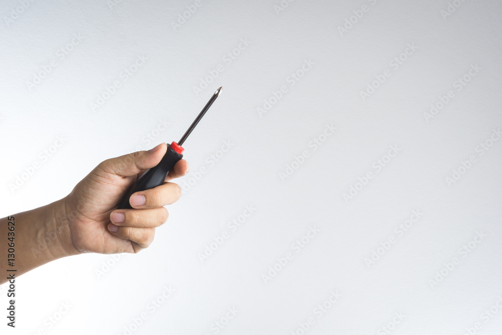 Hand holding screwdriver Hand holding screwdriver