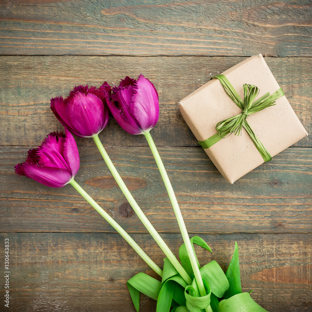 Tulip flowers and gift. Flat lay, Top view Tulip flowers and gift. Flat lay, Top view