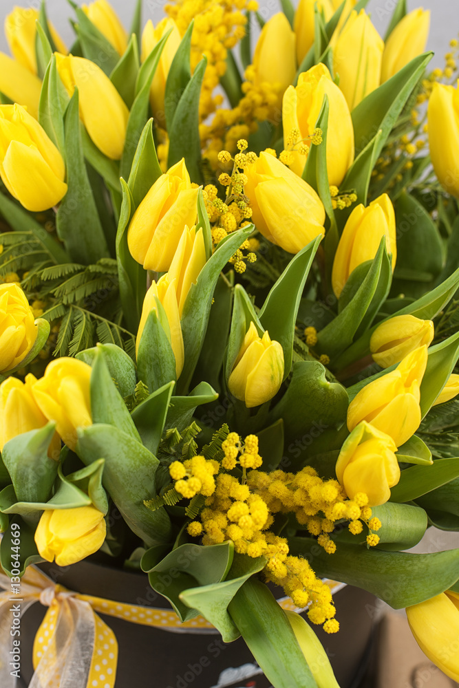 Bright spring bouquet of tulips and mimosa flowers Bright spring bouquet of tulips and mimosa flowers