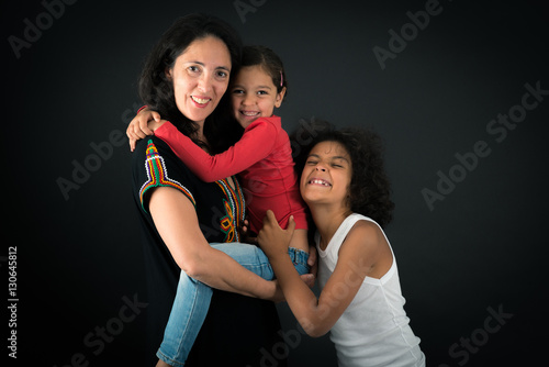 Beautiful family doing different expressions in different sets of clothes: love