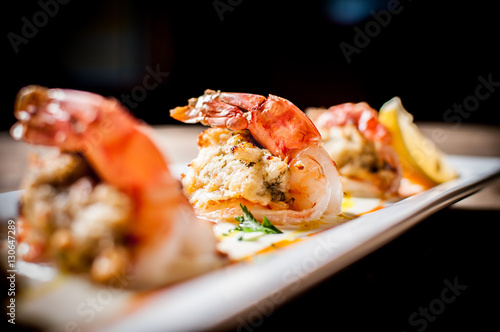 Fotografering Crab Stuffed Shrimp Trio Seafood Appetizer