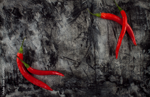 Fresh chili on grunge scratched background. 