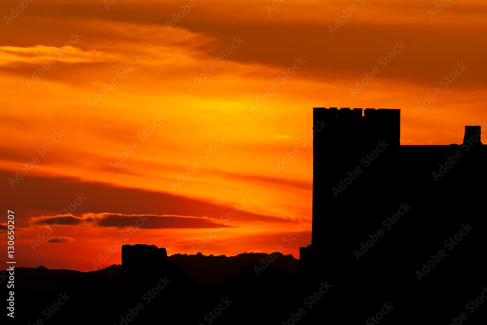 Silhouette of a castle over amazing red sky Silhouette of a castle over amazing red sky
