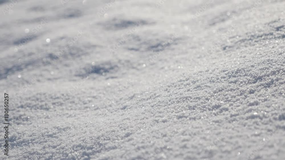 Slow tilt over sparkling white snow dunes on the early morning close-up 4K 3840X2160 UHD video - Frozen crystalline water snowflakes over the hill 2160p UltraHD tilting footage Slow tilt over sparkling white snow dunes on the early morning close-up 4K 3840X2160 UHD video - Frozen crystalline water snowflakes over the hill 2160p UltraHD tilting footage