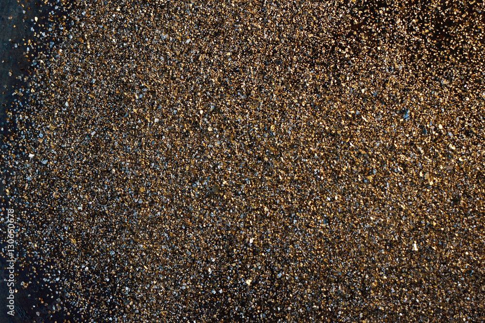 Golden background - dust of gold over black background. Golden background - dust of gold over black background.