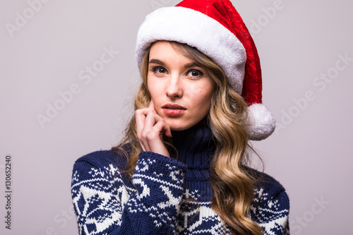 Portrait of happy woman in Christmas Santa hat