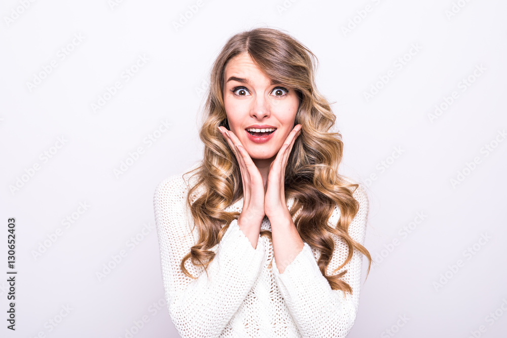Pretty girl model in sweater isoleted on grey Pretty girl model in sweater isoleted on grey