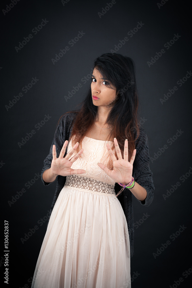 Beautiful woman doing different expressions in different sets of clothes: stop sign Beautiful woman doing different expressions in different sets of clothes: stop sign