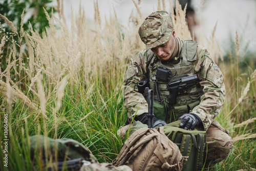 Photography Army rangers during the military operation in the forest