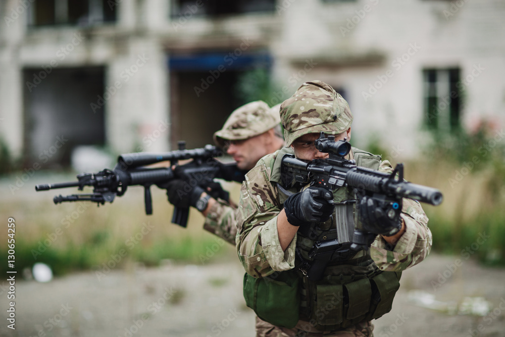 Fototapeta premium Portrait soldier or private military contractor holding sniper 