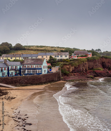 Colourful houses around the sandy bay of Dunmore East, Waterford, Republic of Ireland photo