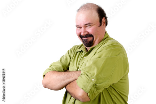 Smirking middle aged man with folded arms