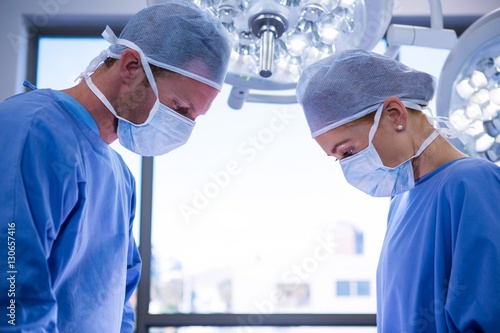 Surgeons performing operation in operation theater