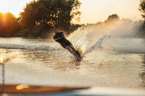 Water skier in action on the lake photo