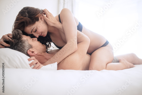 Canvas Print Intimate lovers in bed making love