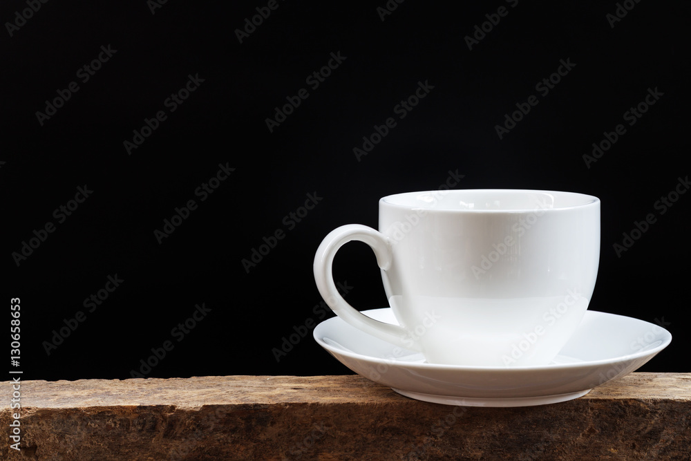 White coffee cup on a black background.