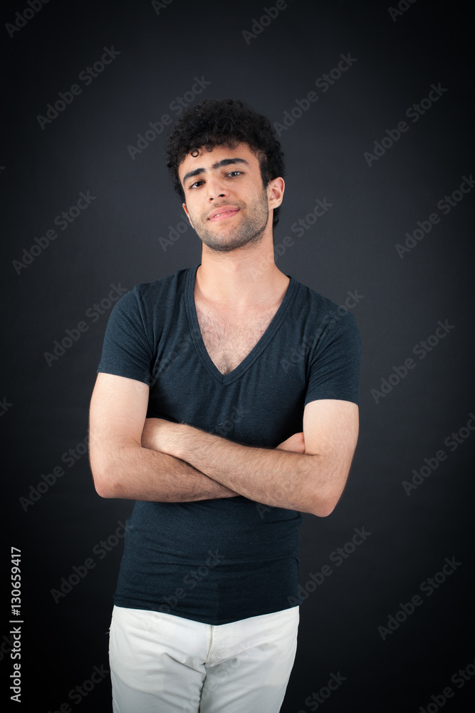 Handsome man doing different expressions in different sets of clothes: arms crossed Handsome man doing different expressions in different sets of clothes: arms crossed