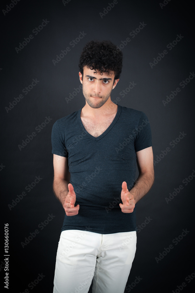 Handsome man doing different expressions in different sets of clothes: gun sign Handsome man doing different expressions in different sets of clothes: gun sign