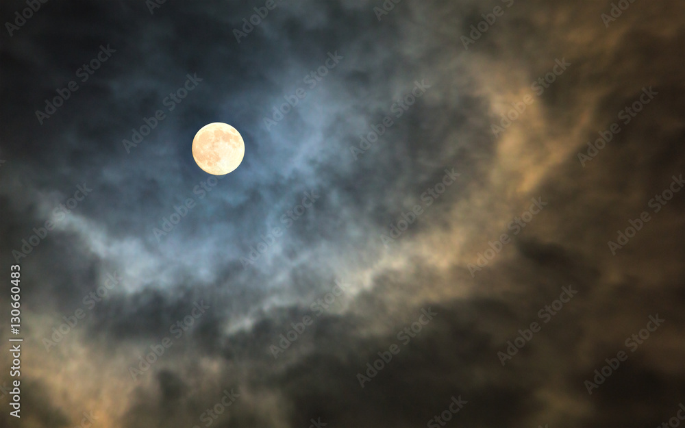Fototapeta premium Mysterious midnight cloudy sky with full moon and moonlit clouds