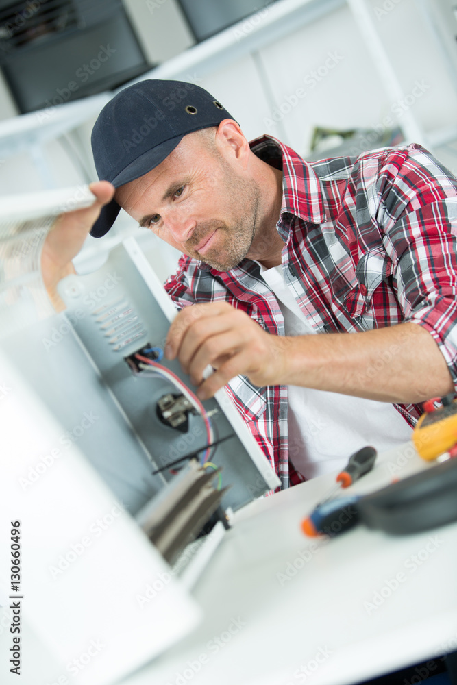 smily repairman fixing computer unit smily repairman fixing computer unit