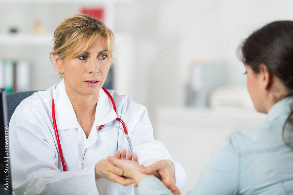 doctor messuring blood pressure of a patient doctor messuring blood pressure of a patient