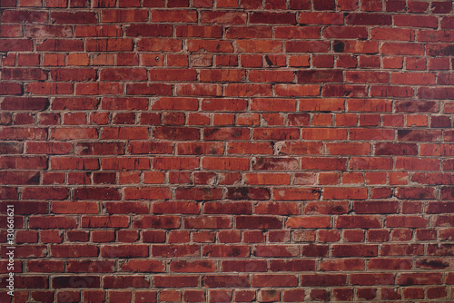 The wall of red brick. Background.