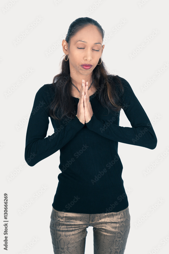 Beautiful woman doing different expressions in different sets of clothes: prayer Beautiful woman doing different expressions in different sets of clothes: prayer