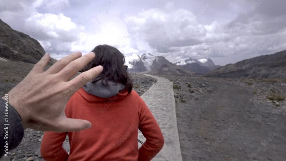 Couple chasing each other and playing happy on the Andean mountains during a trekking of the cordillera blanca. Slow motion Couple chasing each other and playing happy on the Andean mountains during a trekking of the cordillera blanca. Slow motion