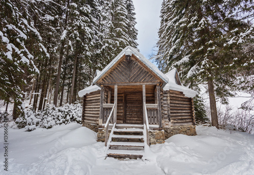 Wooden arbor in snowy forest © Ryzhkov Oleksandr