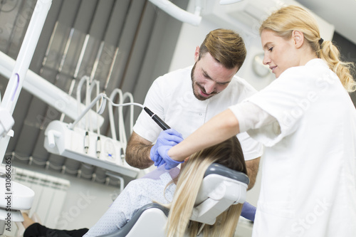 Young woman getting dental ...