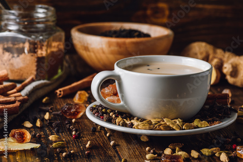 Masala Chai in White Cup with Different Spices