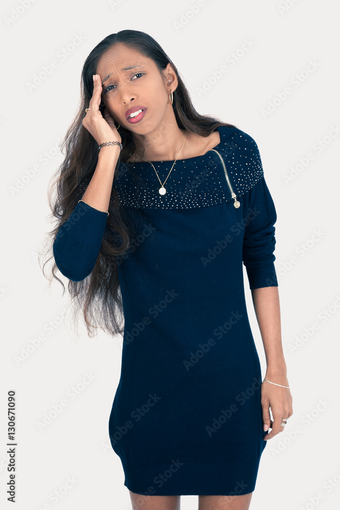 Beautiful woman doing different expressions in different sets of clothes: headache Beautiful woman doing different expressions in different sets of clothes: headache