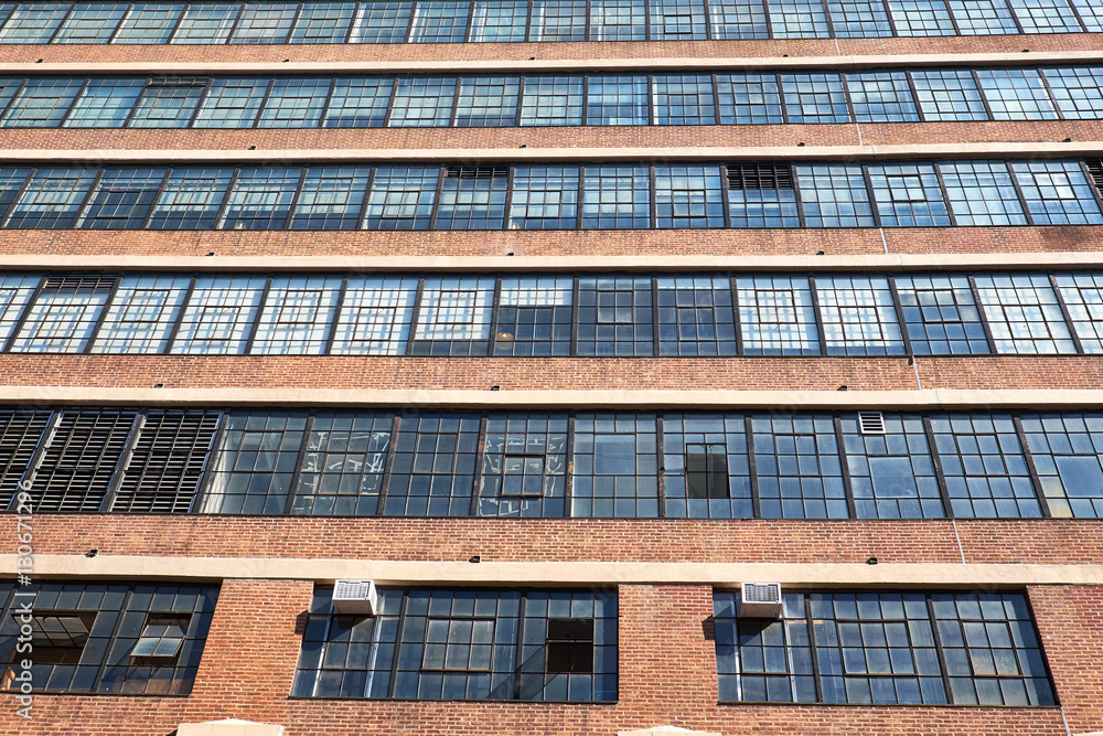 Typical building facade from the 1930th with ribbons of windows and masonry spandrels