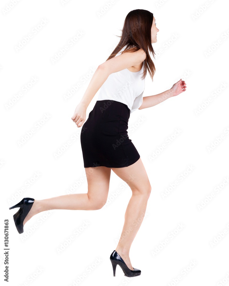 back view of running woman in dress. back view of running woman in dress.
