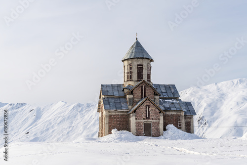 Winter in Greater Caucasus Mountains. Georgia (country). Gudauri ski resort. Georgian orthodox church.