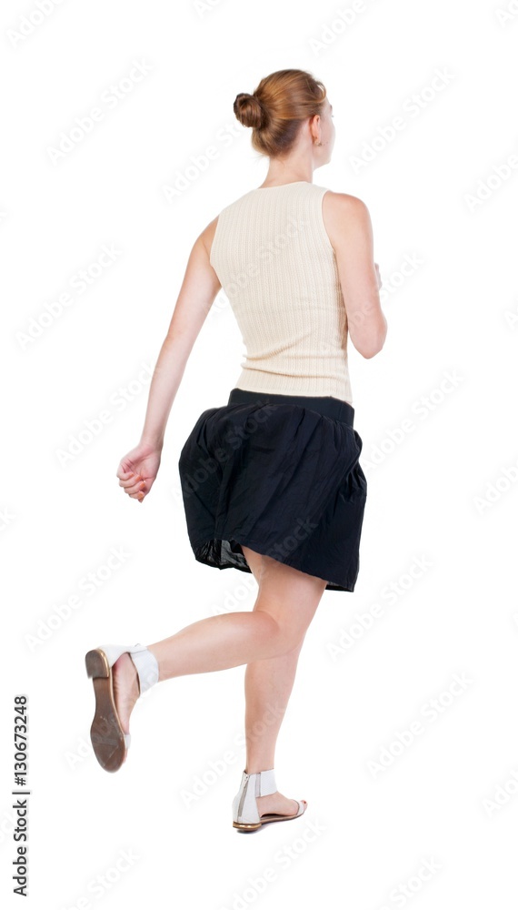 back view of running woman in dress back view of running woman in dress